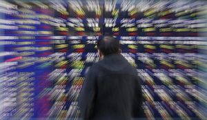 〔金利マーケットアイ〕夜間取引の国債先物は強含み、長期金利0.555％に低下